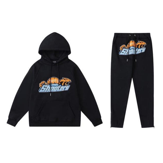 Conjunto trapstar Shooters negro/naranjo